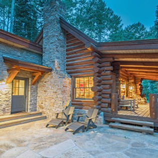 mountain village vacation rental yellow brick cabin exterior