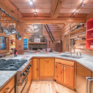 mountain village vacation rental yellow brick cabin kitchen