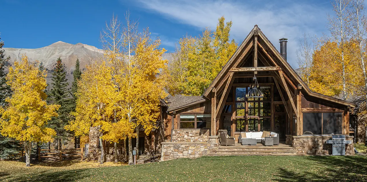 Charming Telluride cabin rental with authentic log construction, cozy mountain atmosphere, and forest setting